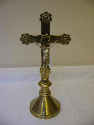 Appraisal: AN ARTS AND CRAFTS BRASS CRUCIFIX with silvered figure and