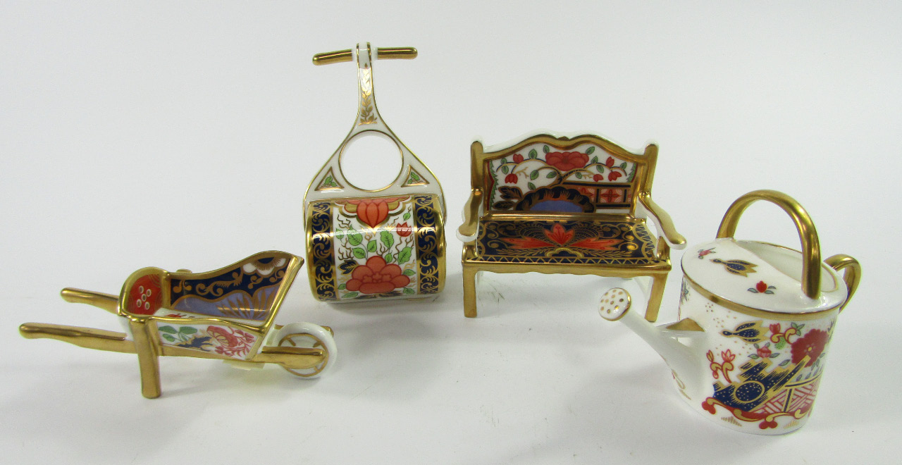 Appraisal: Four Royal Crown Derby Imari pattern paperweights comprising garden bench