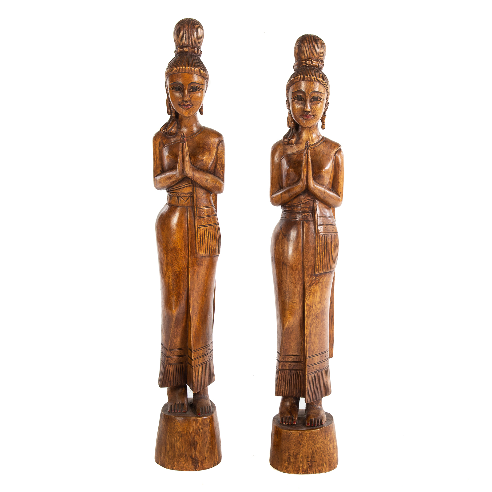 Appraisal: TWO THAI SAWASDEE CARVED WOOD FIGURES Mid-century with pigment highlighted