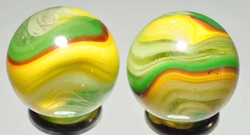 Appraisal: Lot of Fluorescent Akro Popeye Marbles Description Pair of fluorescent