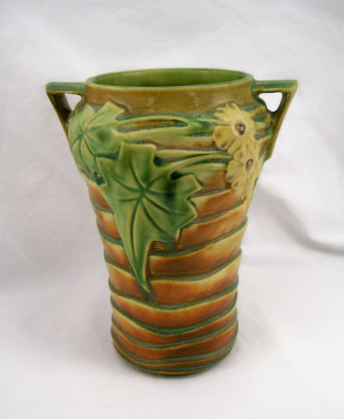 Appraisal: Roseville Luffa Vase Two handled vase with a brown matte