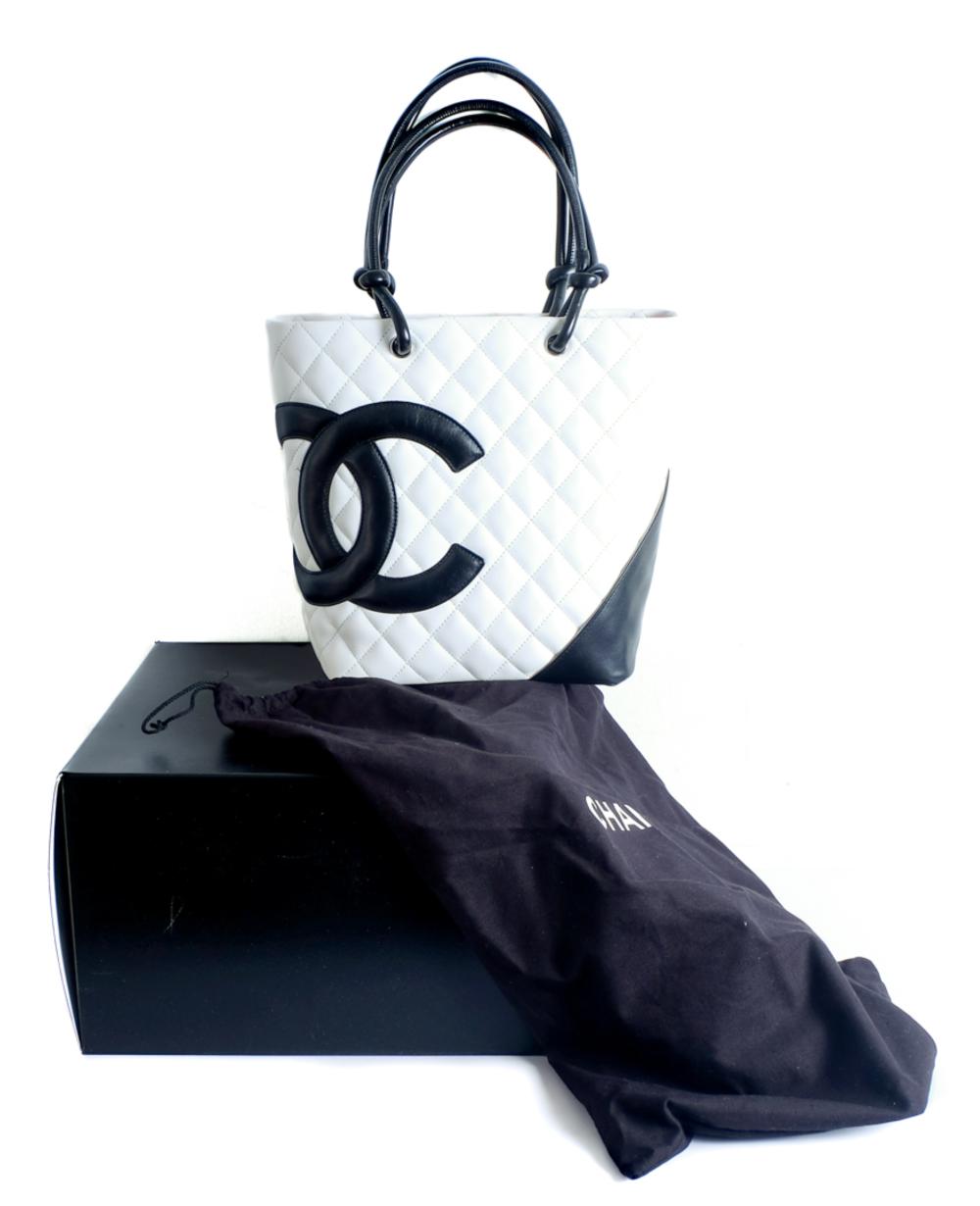 Appraisal: CHANEL PETITE SHOPPING TOTE IN WHITE AND BLACKChanel petite shopping