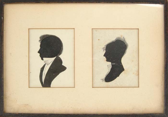 Appraisal: PAIR OF HOLLOW CUT WATERCOLOR SILHOUETTES Framed side by side