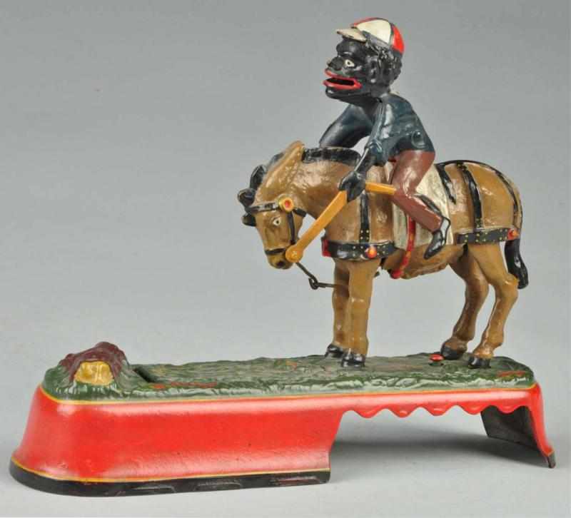 Appraisal: Cast Iron 'Spise a Mule Mechanical Bank Description Jockey over