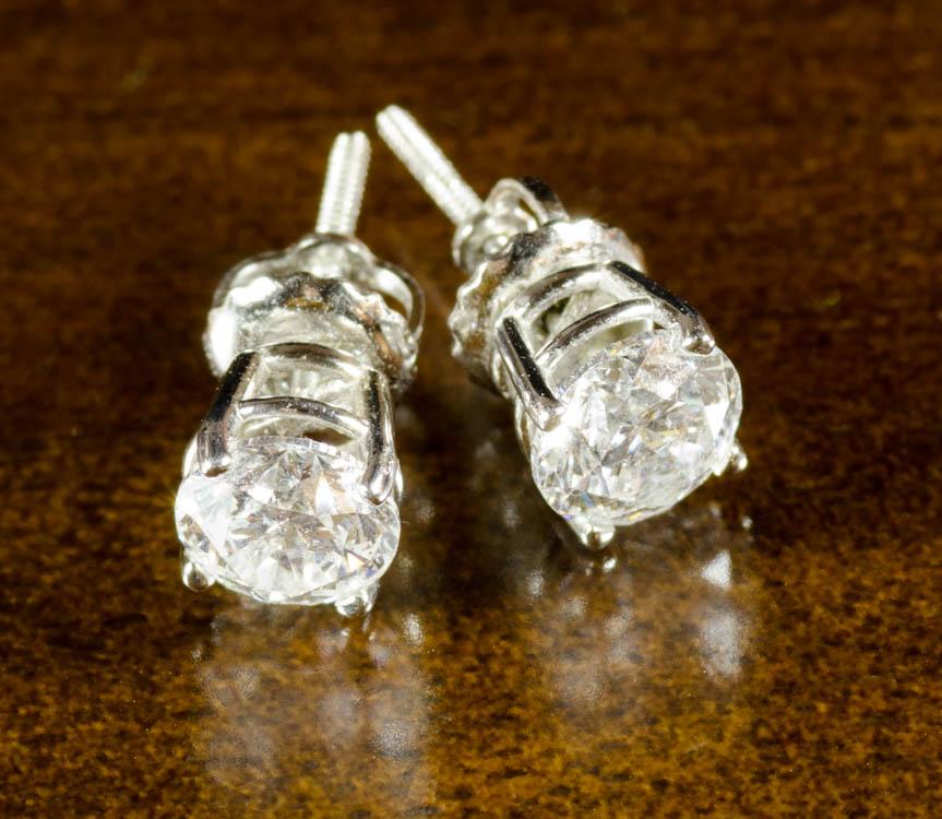 Appraisal: PAIR OF DIAMOND AND WHITE GOLD EAR STUDS with GSL