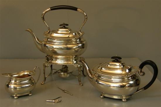 Appraisal: George V three piece silver tea service comprising kettle on