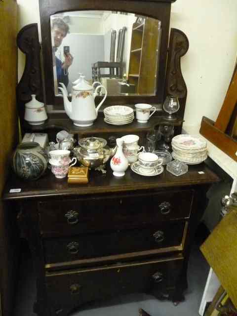 Appraisal: A VICTORIAN DARK STAINED DRESSING CHEST the swing mirror with