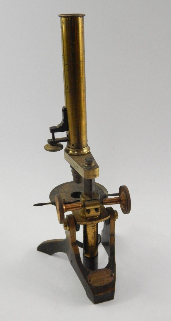 Appraisal: A Victorian brass and iron Pharmacy Microscope circa base bearing