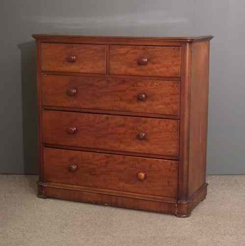 Appraisal: A Victorian figured mahogany chest of drawers with rounded front