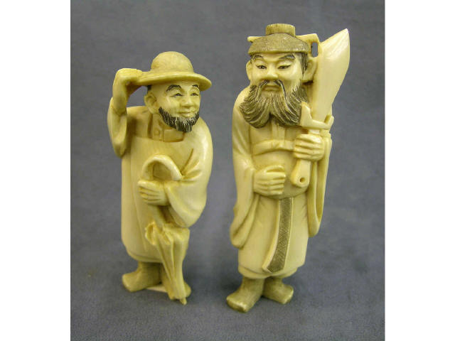 Appraisal: Two tall standing netsuke depicting General Kuan Yu Guan Yu