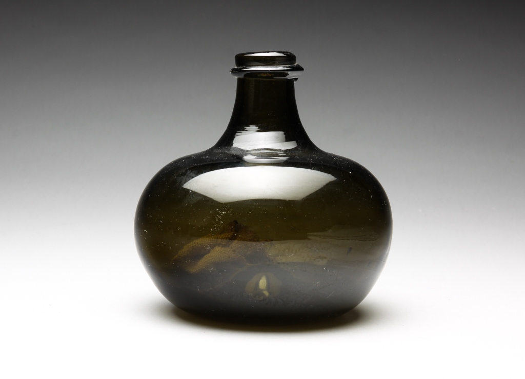 Appraisal: ENGLISH BLOWN GLASS ONION BOTTLE Early th century Dark olive