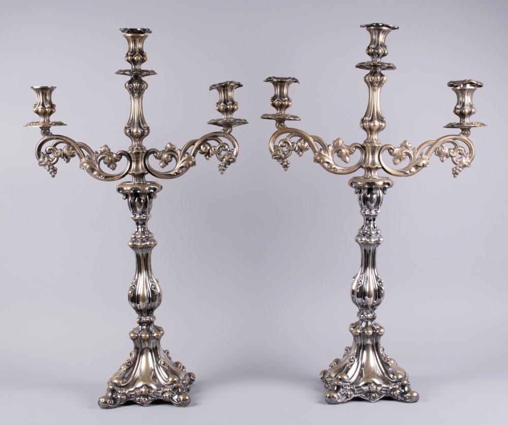 Appraisal: PAIR OF WEIGHTED AND PARCEL-GILDED SILVERPLATED CANDELABRA AND BRANCHING ARMS