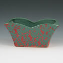 Appraisal: McCoy planter with unusual gloss green over matte pink glazes