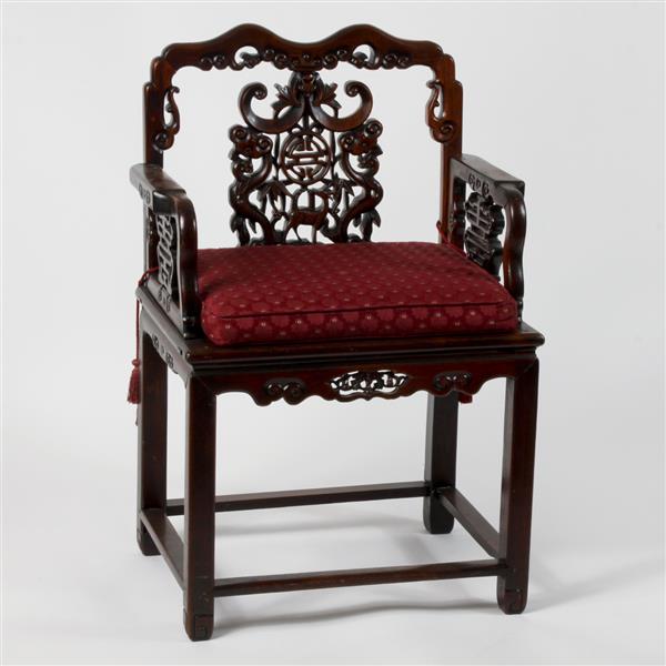 Appraisal: Chinese carved hardwood armchair with shaped top rail and and