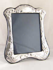 Appraisal: An Art Nouveau style strut back silver photo frame x