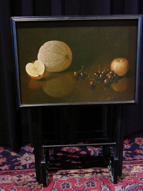 Appraisal: SET OF FOUR BLACK PAINTED TV TRAYS Each depicting fruit