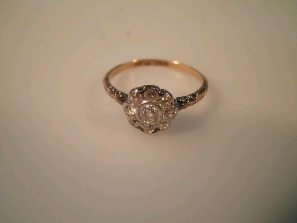 Appraisal: A flower head cluster diamond set ring centre stone of