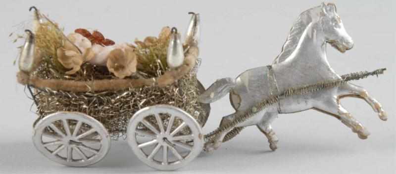 Appraisal: Dresden Christmas Ornament Description Horse pulling a carriage with baby