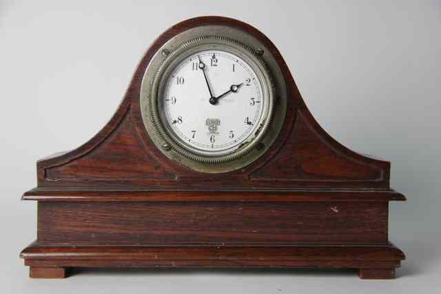 Appraisal: A Smiths car clock mounted in an oak case cm