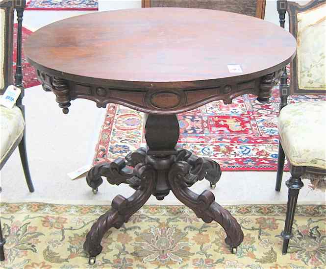 Appraisal: LATE VICTORIAN WALNUT LAMP TABLE American c having an oval