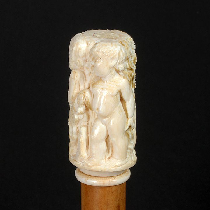 Appraisal: Bone Putti Dress Cane Mid th century- A high relief