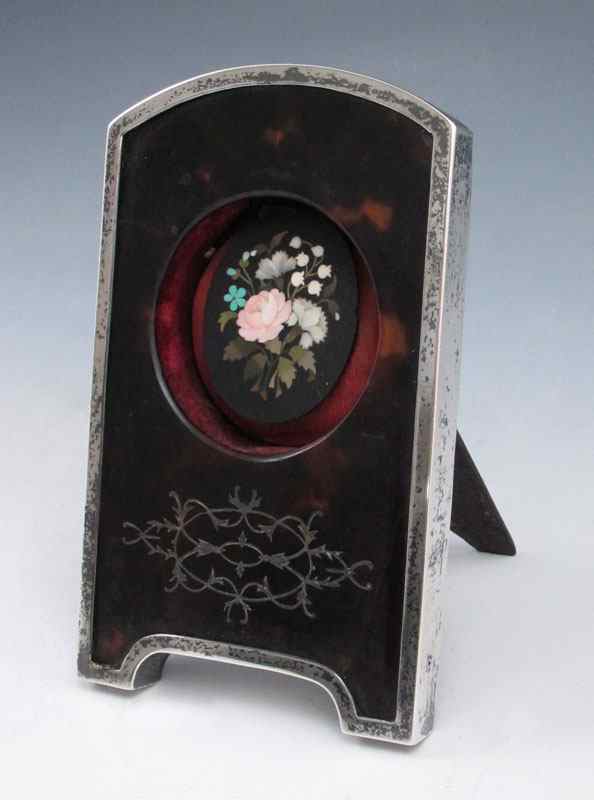 Appraisal: MICRO MOSIAC IN ENGLISH STERLING FRAME Inlaid floral design micro