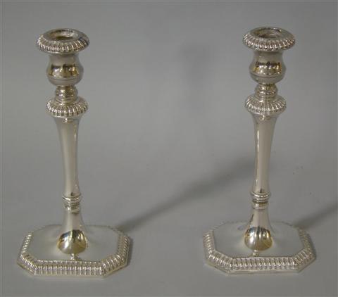 Appraisal: PAIR OF SHEFFIELD SILVERPLATE CANDLESTICKS Impressed Sheffield Company Silverplate -