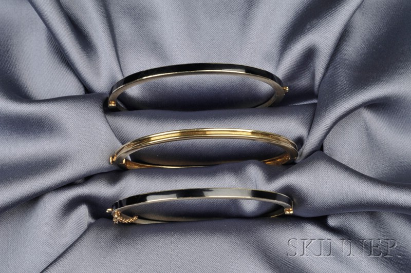 Appraisal: Three kt Gold Bangles two with black enamel accents interior