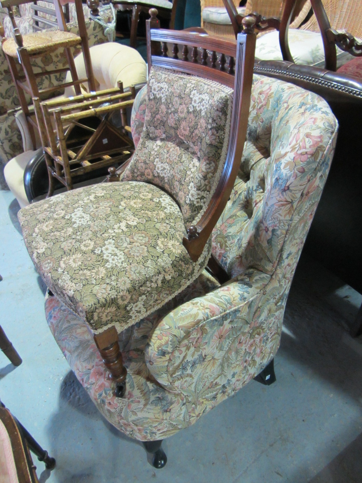 Appraisal: A button upholstered floral pattern modern armchair and an Edwardian