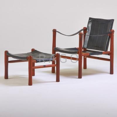 Appraisal: DANISH Lounge chair and ottoman s Teak and saddle leather