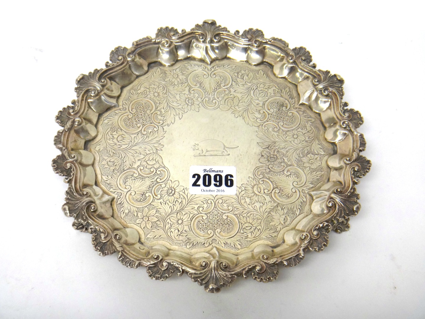 Appraisal: A silver salver of shaped circular form with pie crust