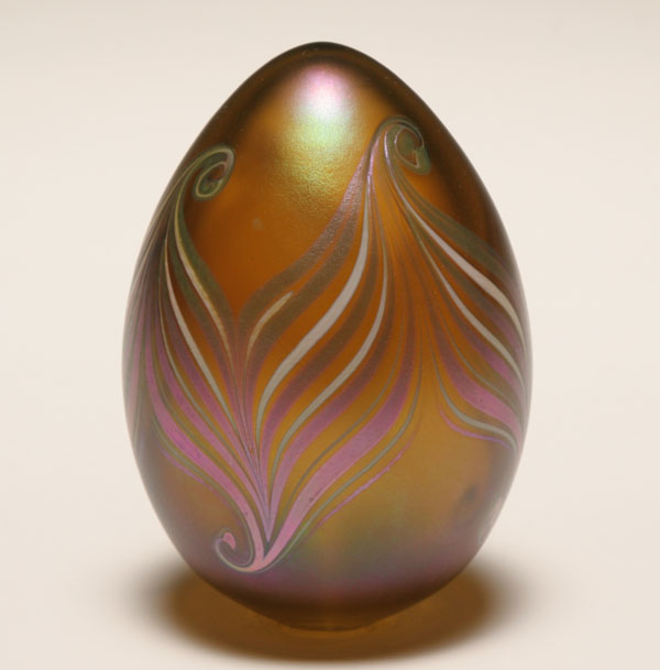 Appraisal: Contemporary blue iridescent glass egg shaped paperweight Purple silver and