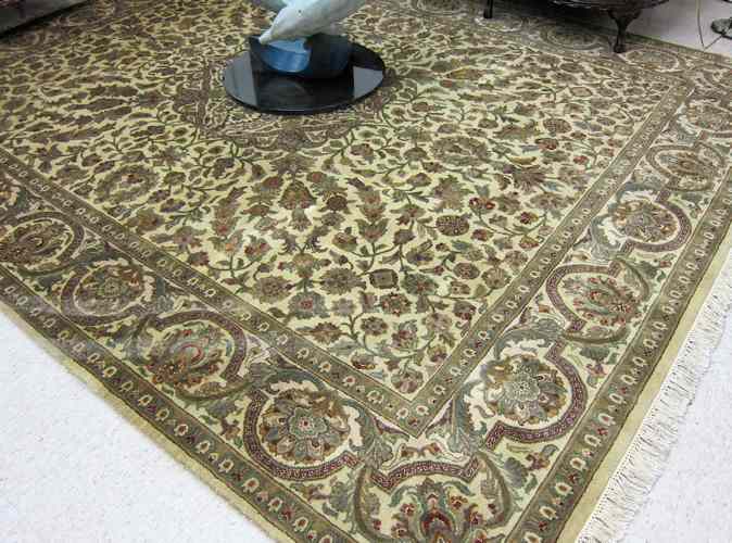 Appraisal: HAND KNOTTED ORIENTAL CARPET Indo-Persian floral and central floral medallion