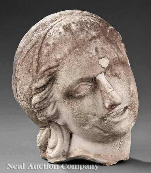 Appraisal: A Roman Marble Antiquity Fragment of a Woman's Head detached