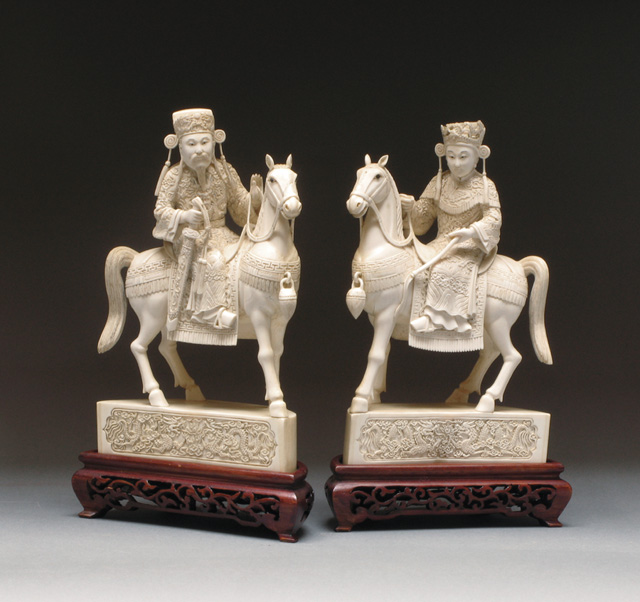 Appraisal: PAIR SOLID ELEPHANT IVORY CARVED FIGURES one depicting the Chinese