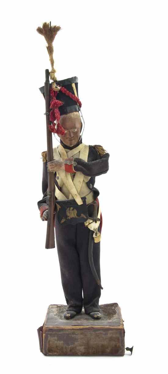 Appraisal: A French Carved Wood Automaton Napoleonic War Figure th century