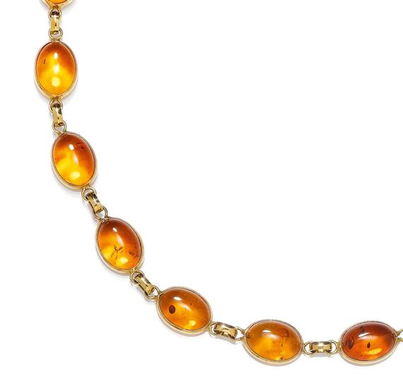 Appraisal: AMBER AND GOLD NECKLACE Yellow gold Fancy necklace of a