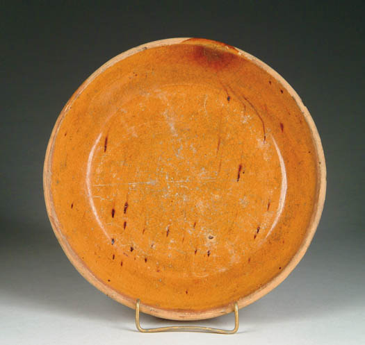 Appraisal: GLAZED REDWARE PLATE SHALLOW BOWL Light orange glaze with dark