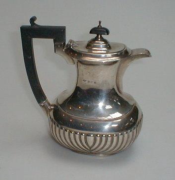 Appraisal: A George V silver hot water jug of oval baluster