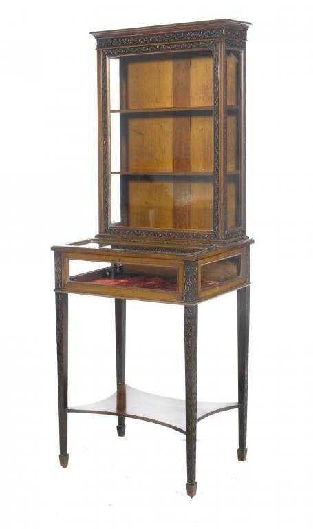 Appraisal: A MAHOGANY BLIND FRET CARVED DISPLAY TABLE the shelved superstructure