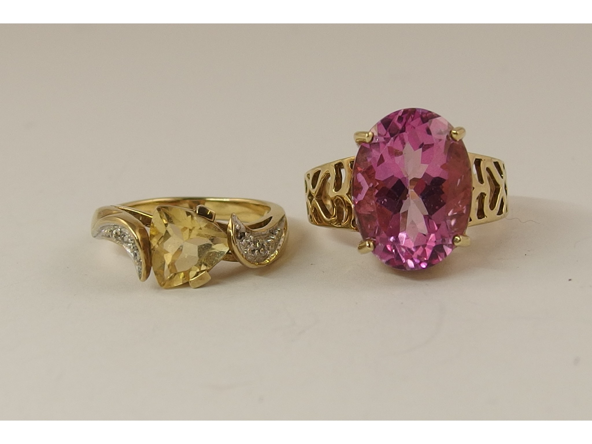 Appraisal: A ct flamingo topaz ring and a ct citrine and