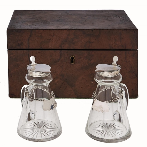 Appraisal: A pair of George V silver mounted glass whisky noggins