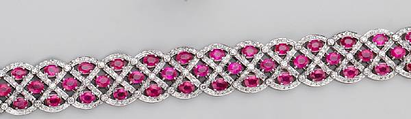 Appraisal: the flexible bracelet designed with oval-shaped rubies set in horizontal