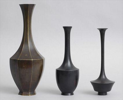 Appraisal: THREE JAPANESE BRONZE VASES The largest of octagonal baluster-form the