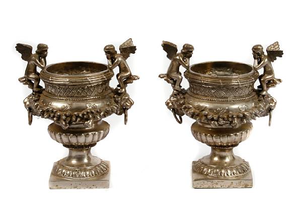 Appraisal: A pair of Rococo style silvered bronze urns height in