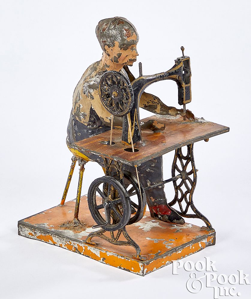 Appraisal: Bing man at sewing machine steam toy accessory Bing painted