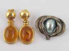 Appraisal: A pair of yellow metal tests carat gold amber earrings