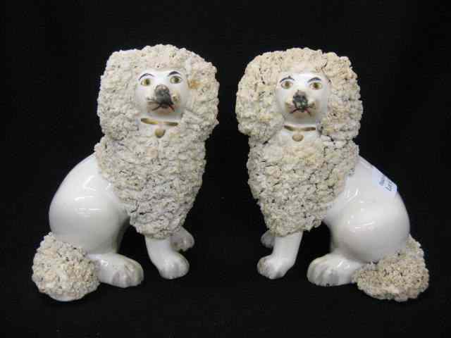 Appraisal: Pair of Staffordshire Pottery Dog Figurines elaborate textured ''fur'' trim