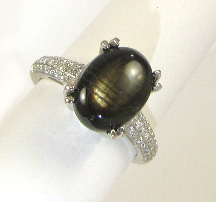 Appraisal: BLACK STAR SAPPHIRE AND DIAMOND RING k white gold with