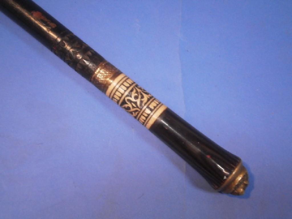 Appraisal: A thC Anglo Indian ebonised swordstick with brass lions head